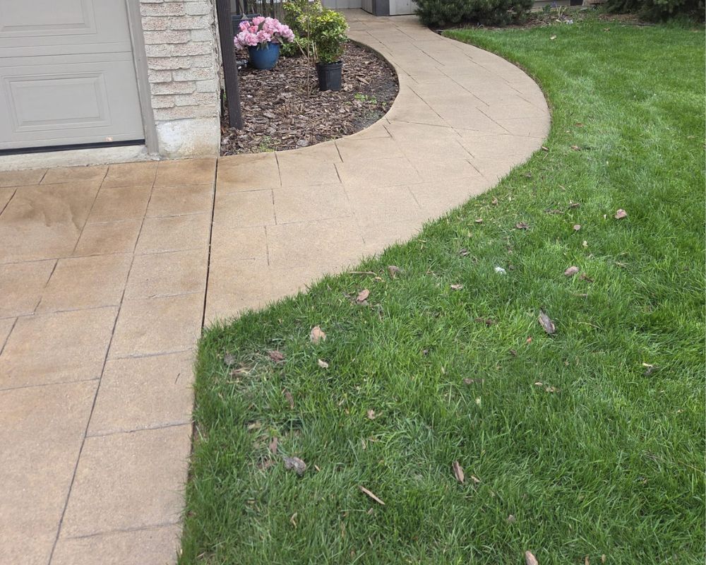 Professional walkway sealing and concrete maintenance for a curved residential path in Oakville by Bespoke Handyman
