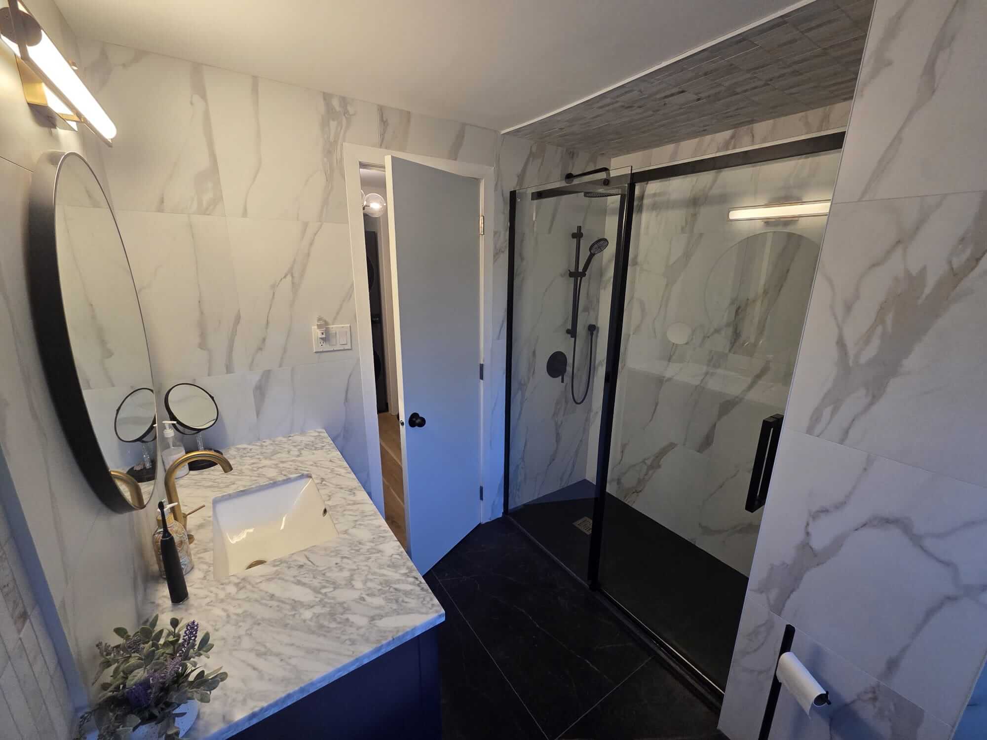 Frameless glass shower installation with a custom textured stone ceiling in an Oakville bathroom renovation by Phil of Bespoke Handyman.