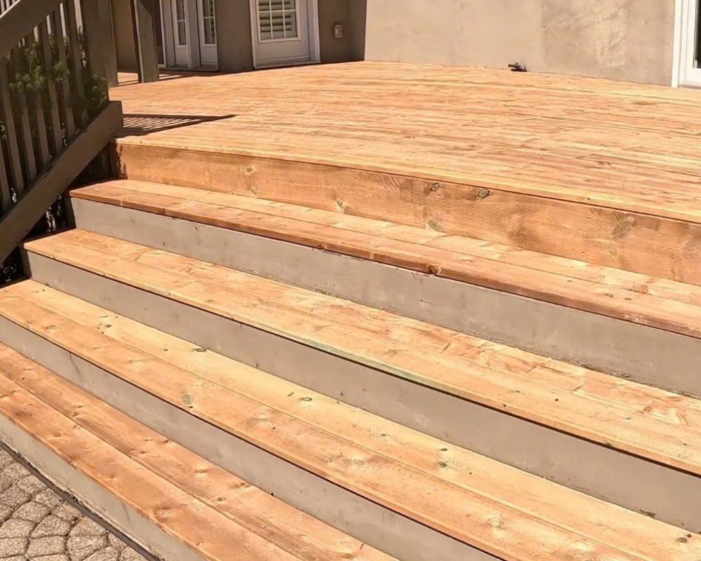Beautifully finished wooden deck stairs built by a professional deck contractor in Oakville.