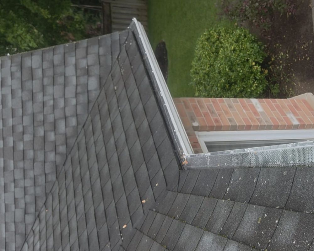 Close-up of a heavy-duty eavestrough screen properly fitted onto a clean gutter system.