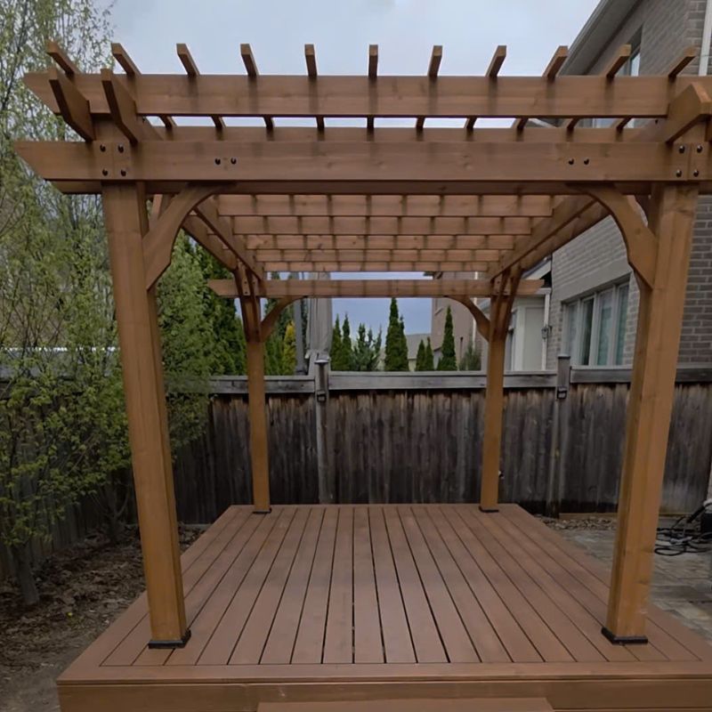 Yardistry cedar pergola installation on a custom wooden deck in Oakville backyard by Bespoke Handyman